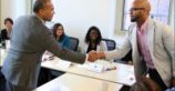 Governor Deval Patrick shaking hands with participant at the Merrimack Valley Sandbox.