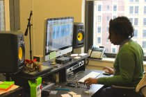 Meanwhile,  F# director of audio Kenn Richards monitors the sound coming in from the booth.